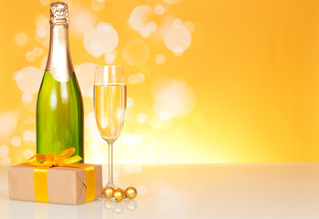 Champagne bottle, glass and gift