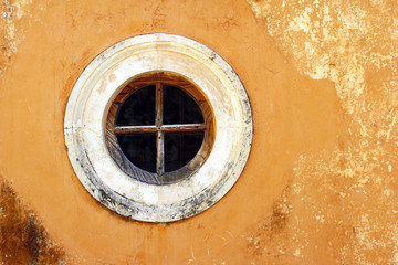 Round window Orthodox monastery on the island of Crete.
