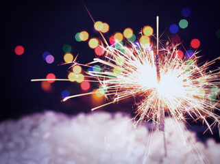holiday background with a sparkler