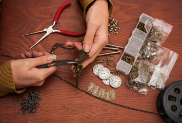 hands making craft jewellery