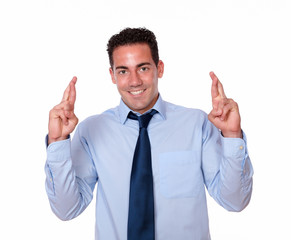 Alone handsome guy crossing his fingers