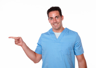 Charismatic latin man pointing to his right