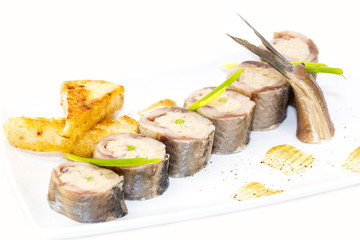 appetizer of herring stuffing on a table in a restaurant