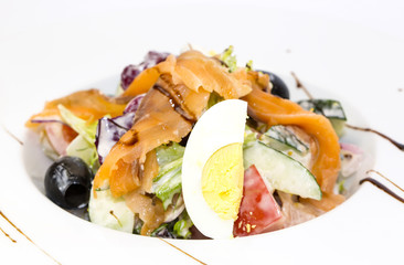 seafood salad vegetables and eggs on a white background