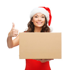 smiling woman in santa helper hat with parcel box