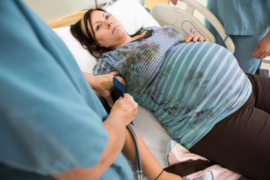Nurse Taking Pregnant Woman's Blood Pressure