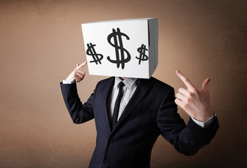 Businessman gesturing with a cardboard box on his head with doll