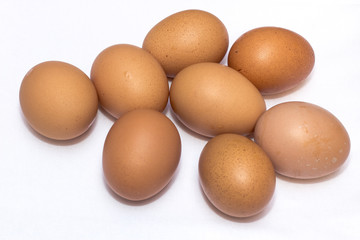 Some Eggs On The Table With Blue Base