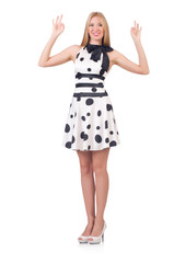 Obraz na płótnie Canvas Tall model dressed in dress with polka dosts on white