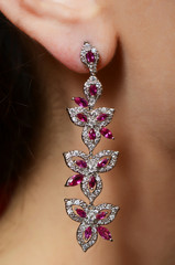 Female ear  in jewelry earrings