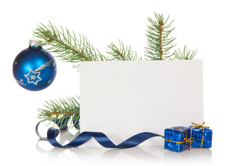 Fir-tree branch with Christmas toy and blank card