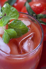 fresh tomato juice with basil, on ice