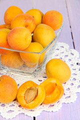 Fresh natural apricot in bowl on wooden table