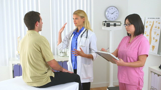 Doctor advising male patient