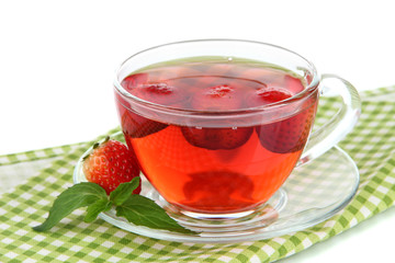 Delicious strawberry tea on table on white background
