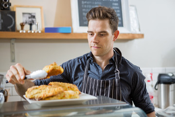 Cafe Owner Serving Sweet Food