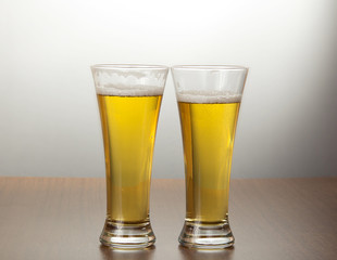 Two mugs of tasty fresh beer
