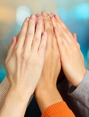 Human hands on bright background