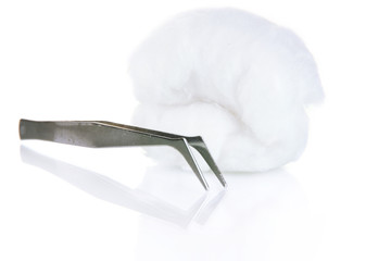 Wadding with tweezers isolated on white
