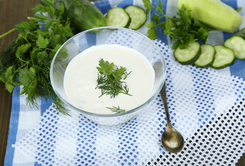 Cucumber yogurt in glass bowl,