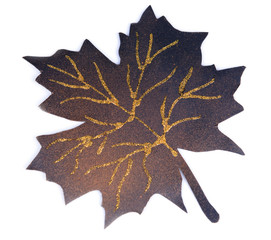 Black maple leaf isolated on white