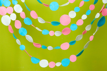 Decorative felt garland on green background © Africa Studio