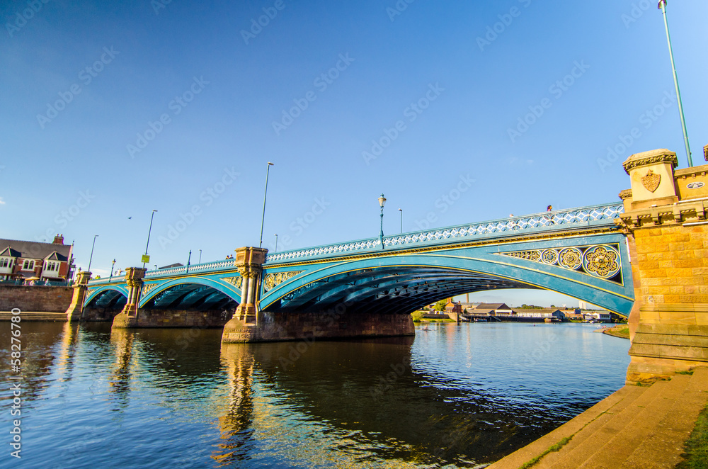 Wall mural steel bridge on the river trent