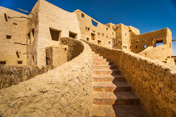 Clay brick stairs in an ancient large house © mpodrucki