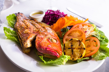 Full Cooked Tilapia Served with Vegetables and Fish Sauce