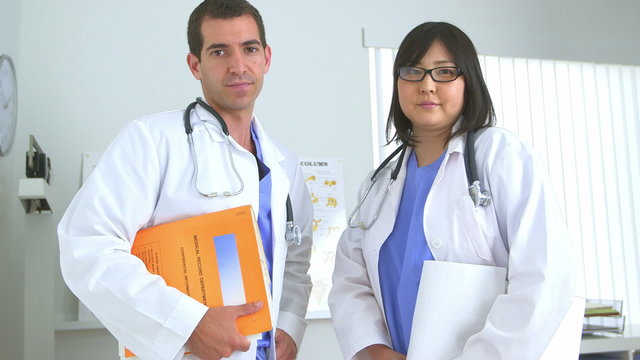 Two doctors standing in the office