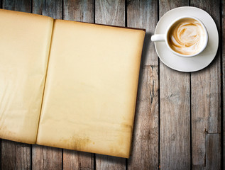 coffee and old  book on wood table