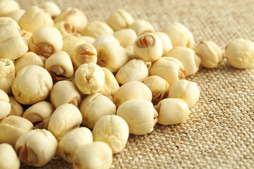 Lotus seed on the linen background