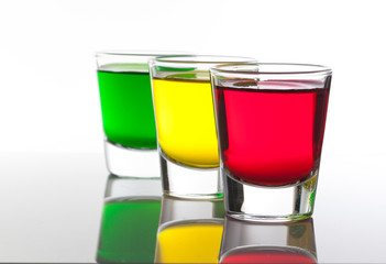 a few glasses of alcoholic drinks in red green yellow