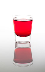 a few glasses of drinks in red