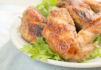 Grilled chicken wings on plate