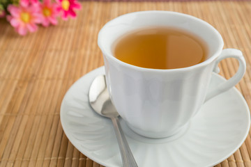 A cup of tea on bamboo mat