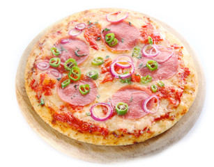 Homemade pepperoni pizza on a board