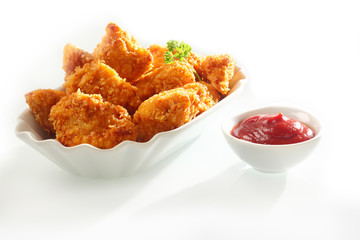Crumbed chicken nuggets with ketchup