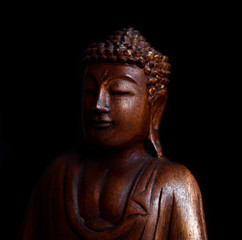 Buddha portrait against black background