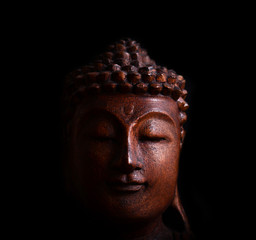 Buddha portrait against black background