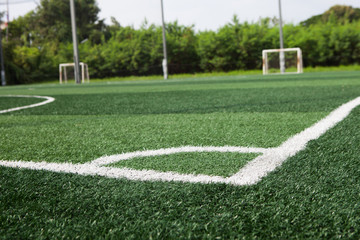 The white line corner on soccer field grass