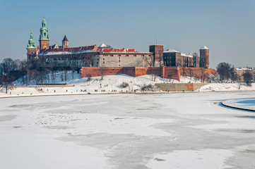 Wawel Castle in Krakow and frozen Vistula river in winter
