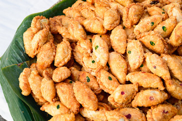 spinner curry puffs on detail in local market, Thailand