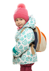 The little girl in winter clothes with a backpack