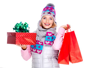 Happy woman with gifts after shopping to the new year