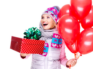 Fun happy adult woman with red gift box and balloons
