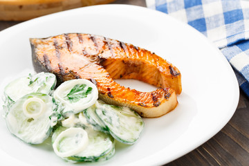 Grilled salmon with cucumber salad