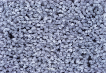 A very close view of grey plush carpet