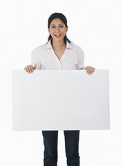 Woman holding a blank placard