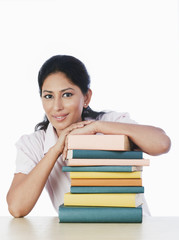 Woman with a stack of books